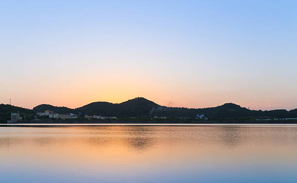istock quiet lake at morning with sunrise 514967439