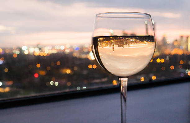 istock White wine glass with city view 514967937