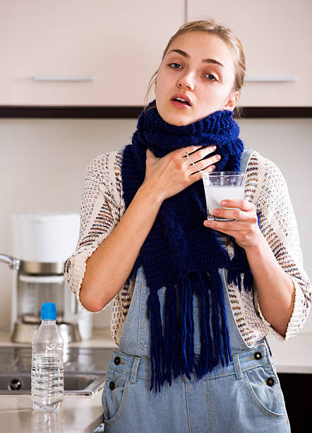 istock Girl with quinsy taking medicine 514981766
