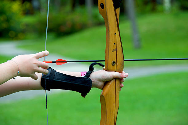 istock Archer about to shoot with bow and arrow 514983128