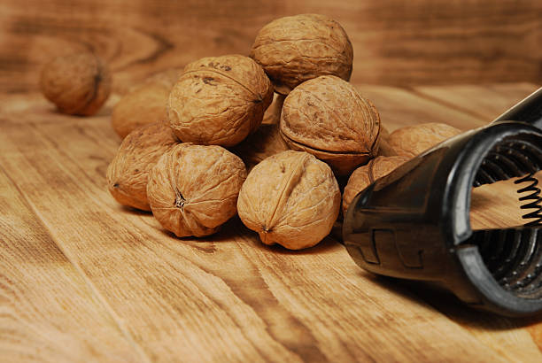 istock Walnuts on the wooden background 514985052
