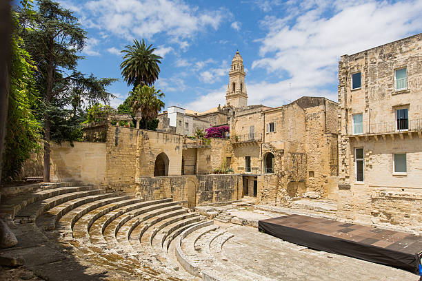Little roman amphitheatre  in Lecce Little roman Theatre and the tower of the Cathedral of Lecce, lecce stock pictures, royalty-free photos & images