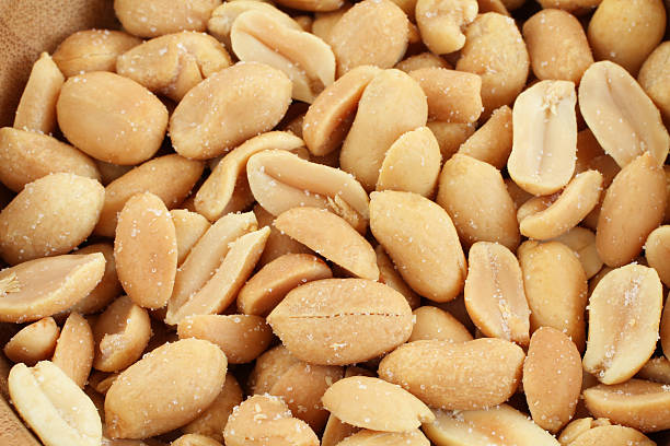 istock Salted roasted peanuts in bamboo bowl 514986160