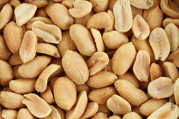 istock Food background - salted roasted peanuts situated arbitrarily 514986172