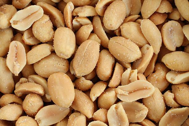 istock Food background - salted roasted peanuts situated arbitrarily 514986176