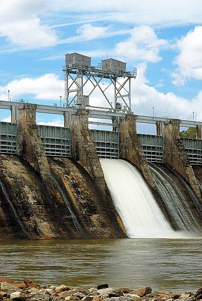 istock Old dam releasing water through the flood gates 514988534