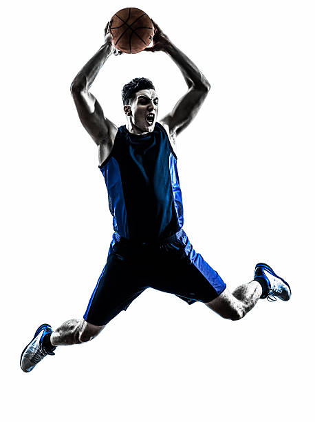 caucasian man basketball player jumping dunking silhouette one man basketball player jumping dunking in silhouette isolated white background silhouette of basketball player slam dunk stock pictures, royalty-free photos & images