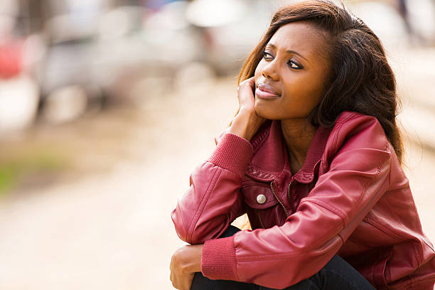 istock young african woman daydreaming 514989177