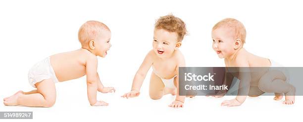 Baby Group Crawling In Diaper Toddler Children Infant Kids Stock Photo - Download Image Now
