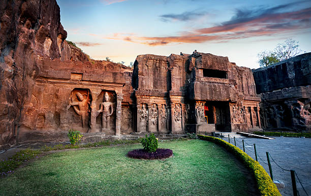 Ellora caves in India Ellora cave entrance in Kailas temple with ancient carved wall near Aurangabad, Maharashtra, India maharashtra stock pictures, royalty-free photos & images