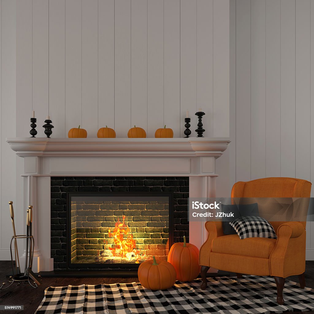 Vintage orange armchair near the fireplace The interior of the living room which is decorated for Halloween with a bright orange armchair near the fireplace and pumpkins Autumn Stock Photo