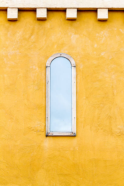 istock Italian style window on yellow wall 514991824