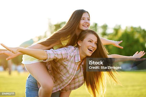 Having A Carefree Day At The Park Stock Photo - Download Image Now - 14-15 Years, Adult, Affectionate