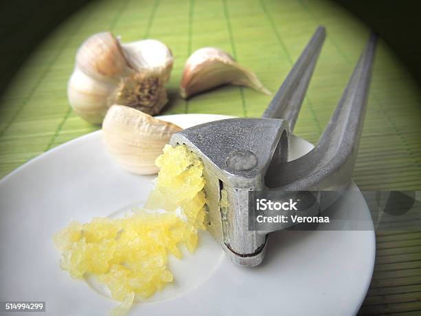 Garlic Bulbs And Garlic Press Stock Photo - Download Image Now - Agriculture, Color Image, Condiment