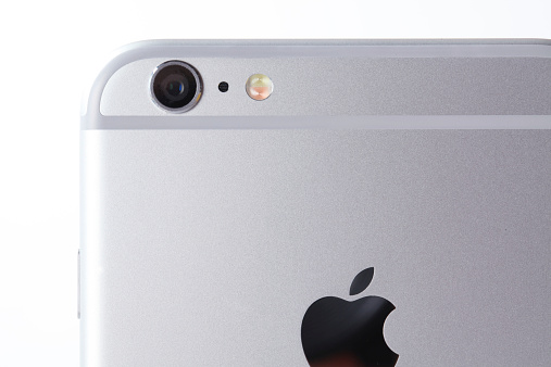 Marbach, Germany - September 27, 2014: White Apple iPhone 6 plus back view - upper part. Studio shot on white.