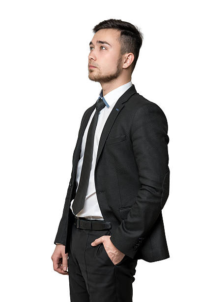 istock Young man a business suit, hands in his pockets, isolated 514995598