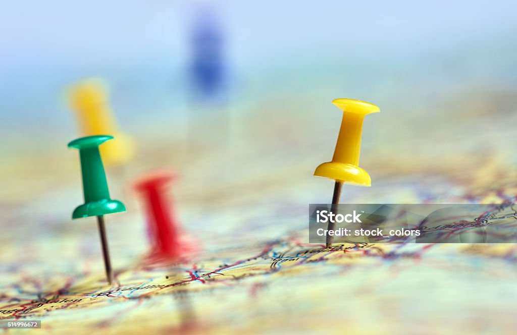 traveling in the world horizontal shot of colorful pins marking different traveling locations on map. City Stock Photo