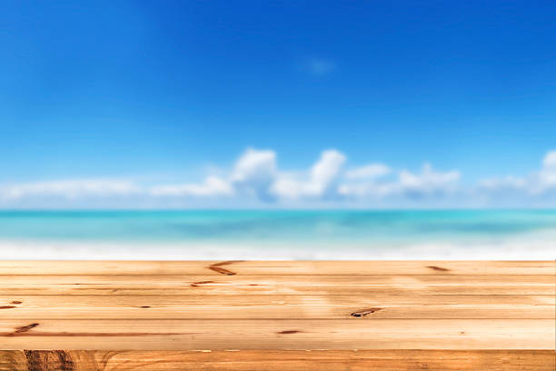istock Top of wooden table on beach 514997918