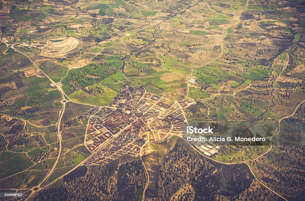 Aerial view of residential area Little village in the middle of the countryside seen from above. The road connections show it like a spider web. Aerial View Stock Photo