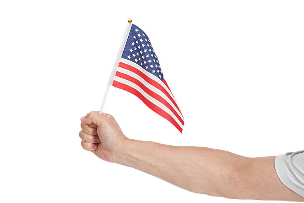 istock Hand holding American flag isolated on white background 514999118