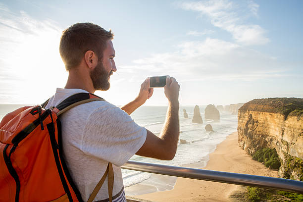 istock Tourist photographs the Twelve Apostles using mobile phone 514999896