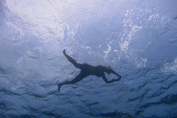 istock woman snorkeling at the surface 515001884