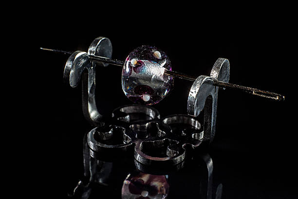 istock Purple glassy bead on stand 515001982