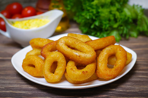 istock deep fried calamari with sauce and salad 515003116