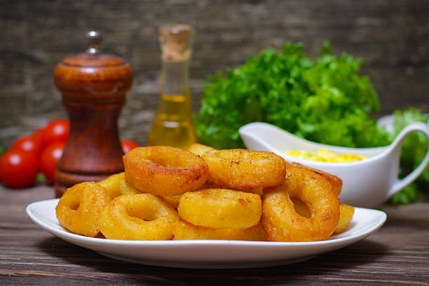 istock deep fried calamari with sauce and salad 515003266