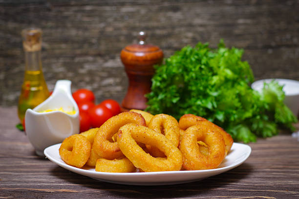 istock deep fried calamari with sauce and salad 515003360