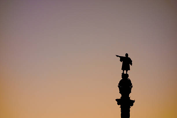 Barcelona Christopher Columbus statue silhouette  over sunset clear sky stock photo