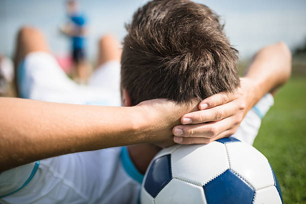 istock Soccer player relaxing on the pitch 515006026