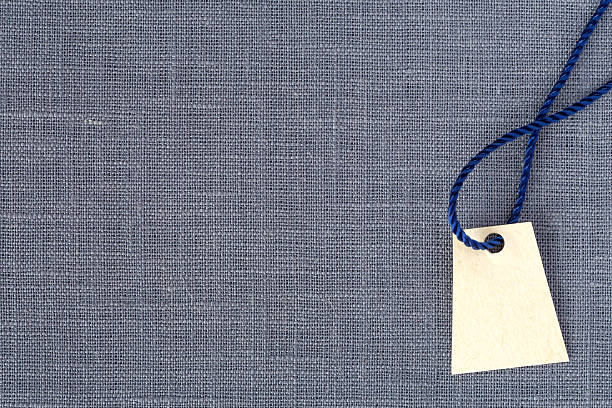 istock Neutral grey Fabric Background and blank Price Tag 515006454