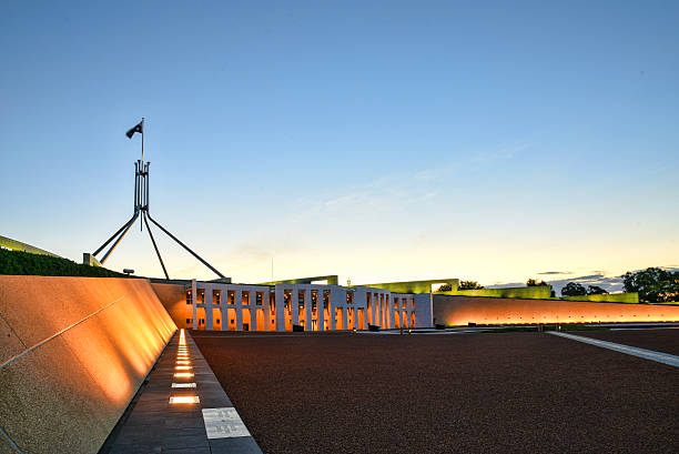 The Parliament House in Canberra at sunset Canberra, Australia, 9 March 2016. The front entrance of the Parliament House in Canberra at sunset canberra stock pictures, royalty-free photos & images