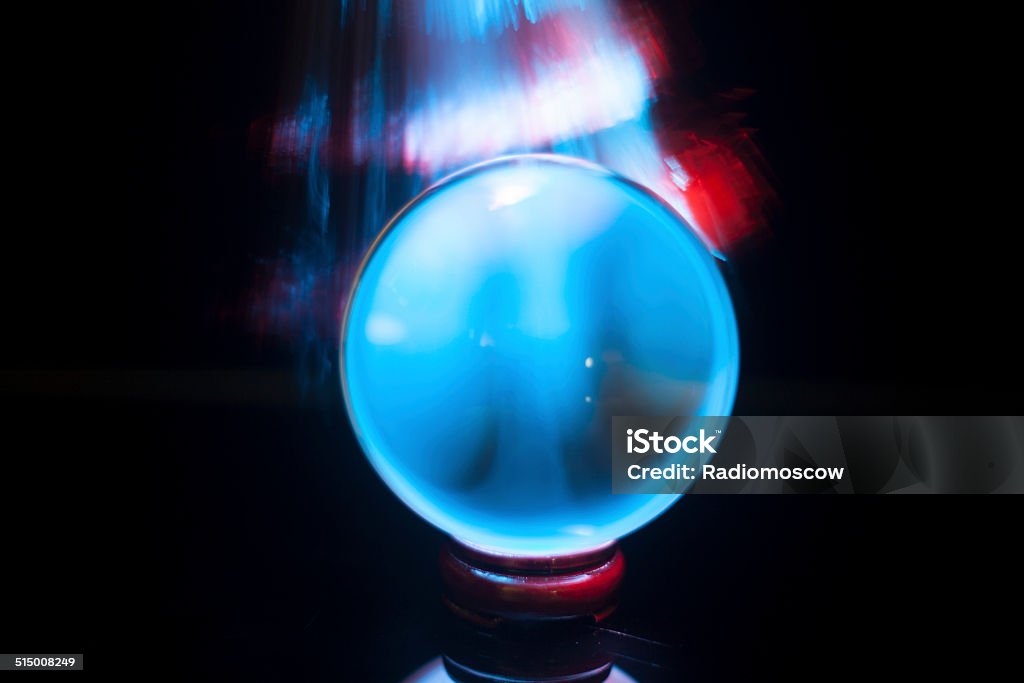 crystal ball blue and red light crystal ball with blue and red lighting Blue Glass Stock Photo