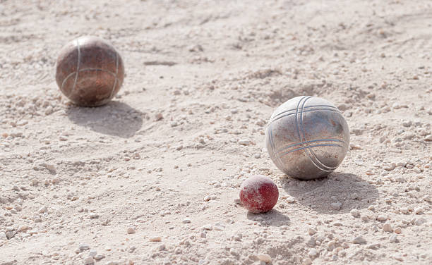istock Metallic petanque balls and a small red jack 515008877