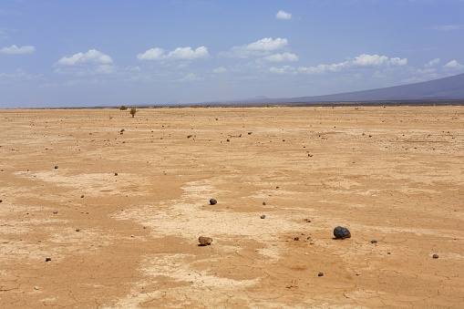 Dry barren land of the Danakil desert-all tracks erased on the way from Afrera town to Dodon-basecamp to the Erta Ale volcano. View to the S.of Hayli Gubbi volcano at 521 ms. Afar region-Ethiopia.