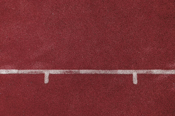 istock tartan track rubber standard red color and white line 515010341