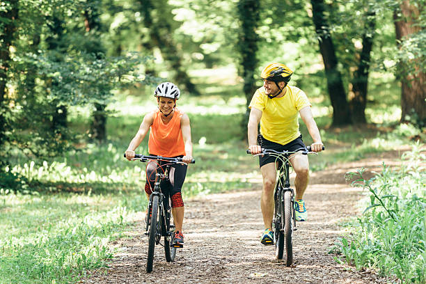 istock Young couple riding bicycles 515011233
