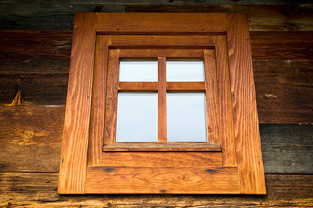 Wooden window at wooden wall, old Balkan architecture style