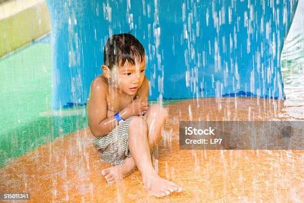 Child Playing In Swimming Pool Stock Photo - Download Image Now - Child, Frozen, Shivering