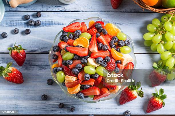 Preparing A Healthy Spring Fruit Salad Stock Photo - Download Image Now - Banana, Berry Fruit, Blueberry