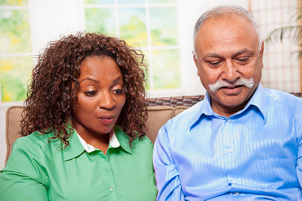 istock Happy mature couple discover information, video chat on digital tablet. 515015413