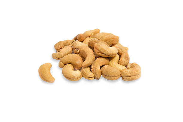 istock Pile of roasted cashew nuts in white background 515015923