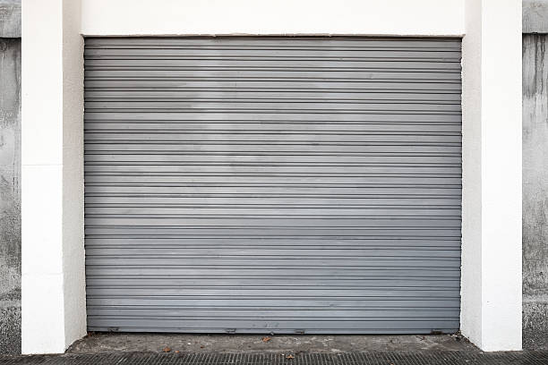 istock Gray metal garage gate, background photo texture 515047543