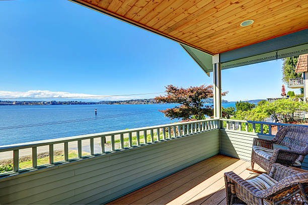 istock Walkout deck with wicker chairs overlooking bay. Port Orchard, W 515049099