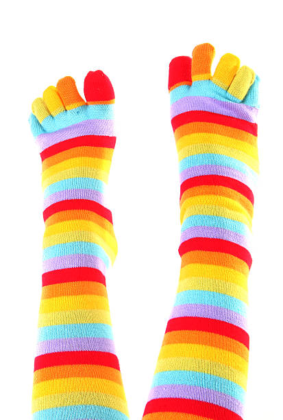 istock Female feet in colorful toe socks 515052345