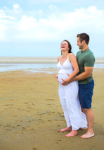 istock Pregnant Couple on the Beach 515052951