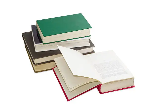 Photo of Open book and stack of several different books