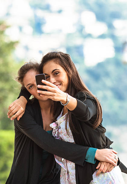 istock Lesbian friends taking a self portrait 515056172